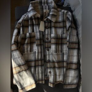 Soft, plaid-style outerwear button-down jacket.